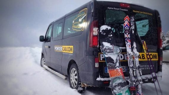 PowderCab minibus from the rear with skis and boards after a shred in the pow