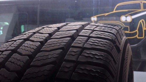 Close-up of a deep-grooved winter snow tyre on a PowderCab minibus